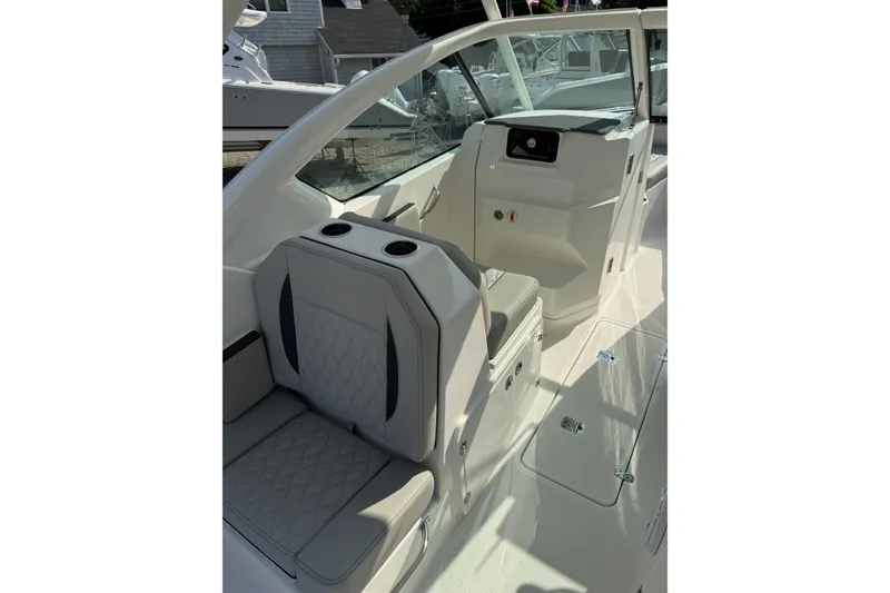 Slide: The Image of 2027 Pursuit DC 266 Dual Console interior with seating and console details. - 6