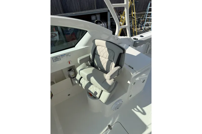 Slide: The Image of 2027 Pursuit DC 266 Dual Console boat seat with elegant design and premium upholstery. - 10