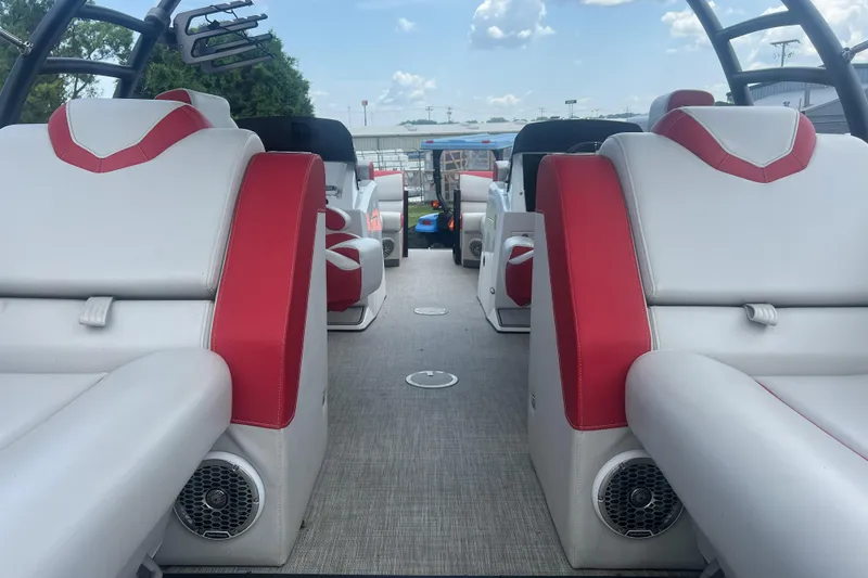 Slide: The Image of Interior of 2020 Monterra Surf boat with red and white seating, speakers, and open deck. - 17