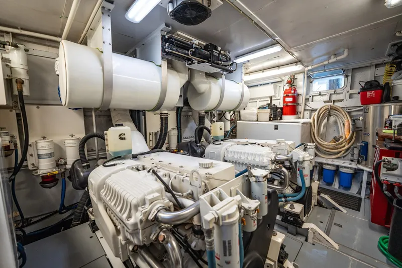 Slide: The Image of Engine room of a 1972 Trumpy 72 Motor Yacht, featuring machinery and equipment. - 46