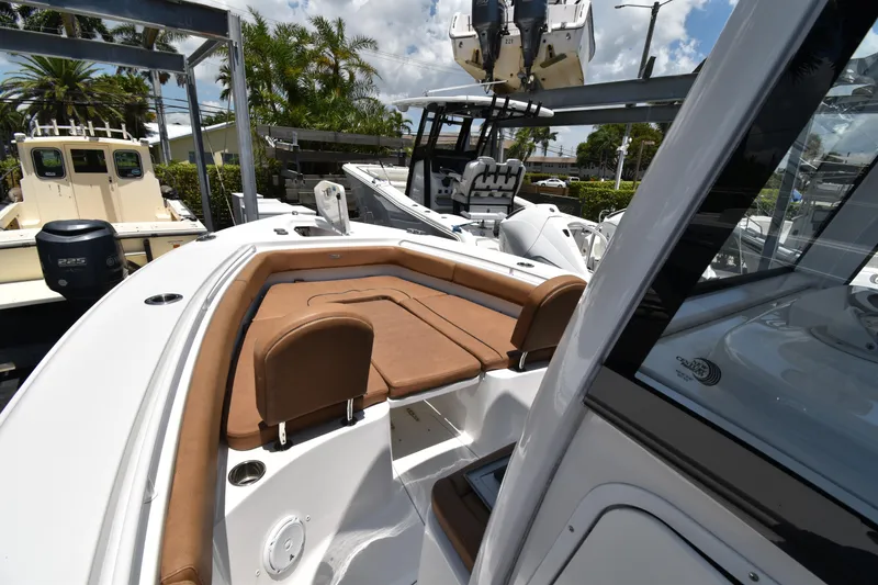 Slide: The Image of 2020 Sea Hunt Ultra 275 SE boat with tan seating and sleek design. - 16