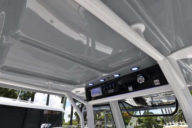 Slide: The Image of 2020 Sea Hunt Ultra 275 SE boat interior with modern control panel and lighting. - 13