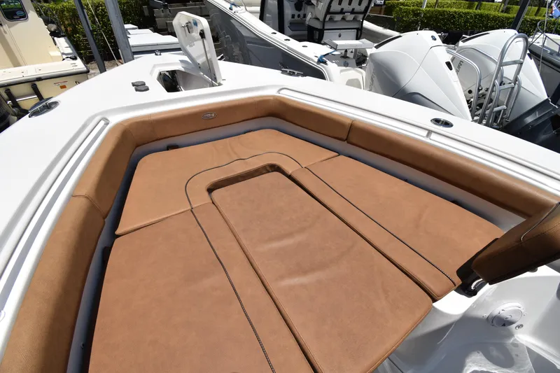 Slide: The Image of Luxurious seating area on a 2020 Sea Hunt Ultra 275 SE boat, featuring brown upholstery. - 7