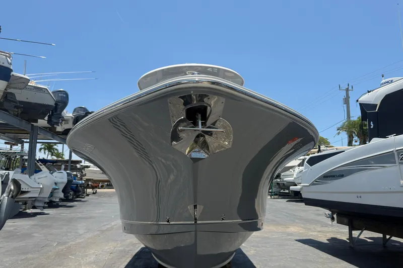 Slide: The Image of 2020 Sea Hunt Ultra 275 SE boat in a marina, viewed from the front. - 2