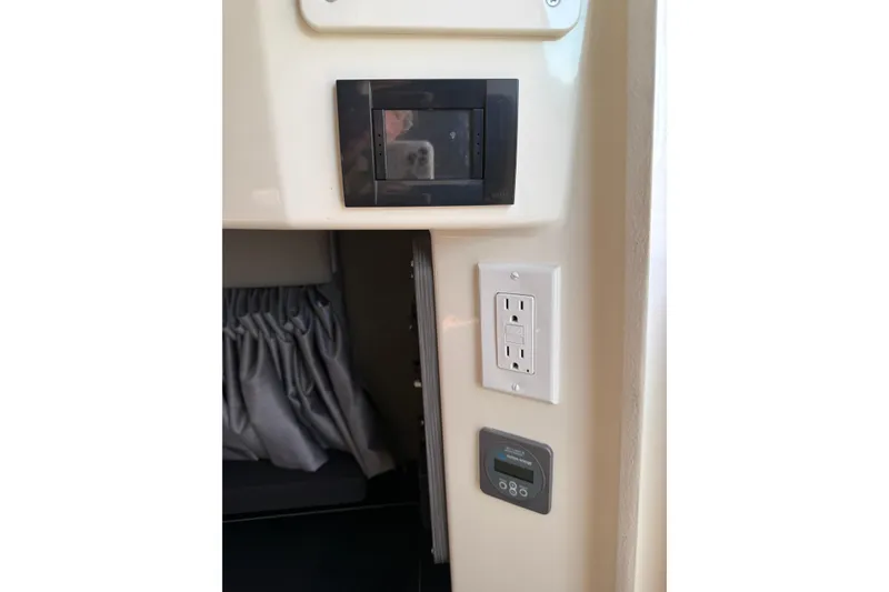 Slide: The Image of 2024 Navan C30 interior showing electrical panel, power outlet, and control panel. - 21