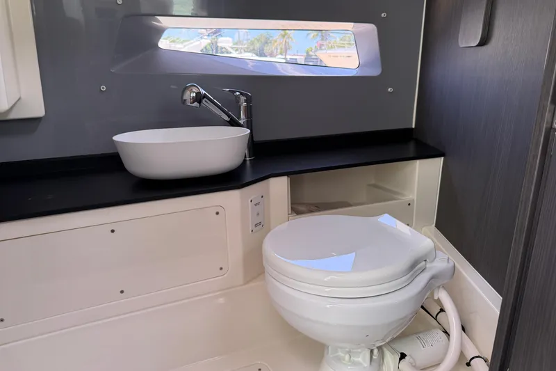 Slide: The Image of Modern bathroom in 2024 Navan C30 boat with sleek sink and compact toilet. - 26