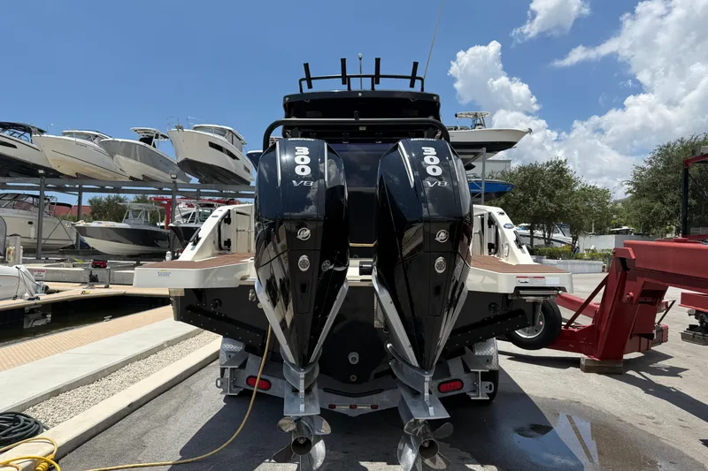 Slide: The Image of 2024 Navan C30 boat with dual 300 V8 engines at a marina. - 3