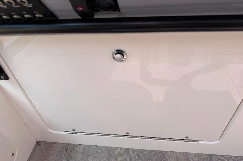 Slide: The Image of 2024 Navan C30 interior panel with control switches and a sleek white finish. - 34