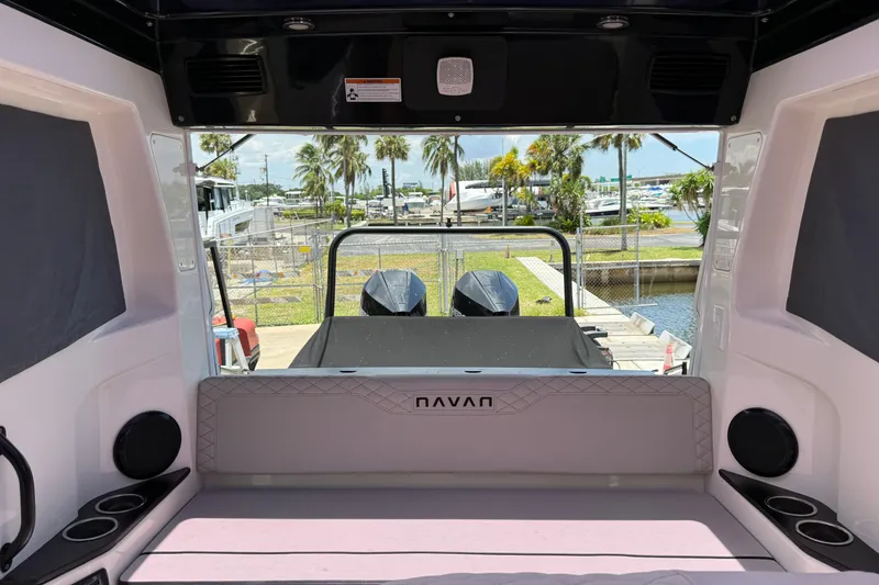 Slide: The Image of Interior view of 2024 Navan C30 boat with marina background and palm trees. - 38