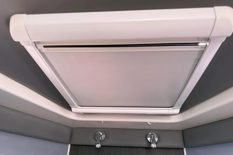 Slide: The Image of 2024 Navan C30 interior ceiling with modern retractable sunroof design. - 32