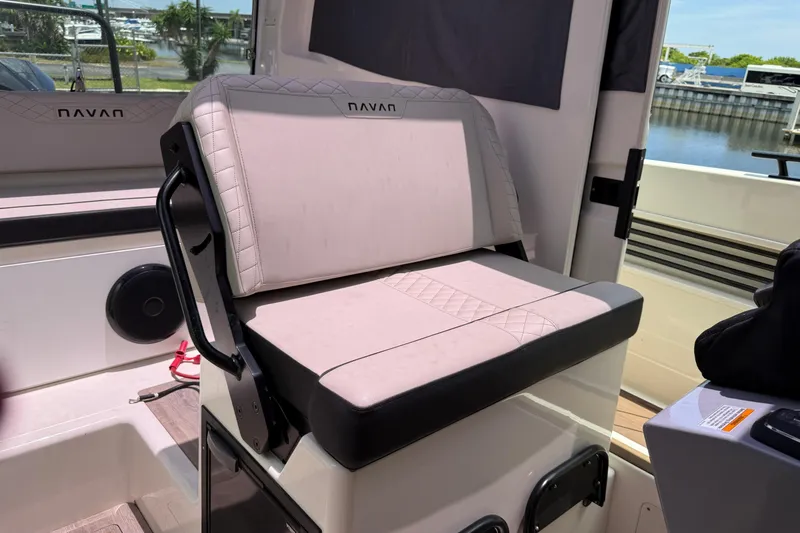 Slide: The Image of 2024 Navan C30 boat interior seat with elegant design and waterfront view. - 13