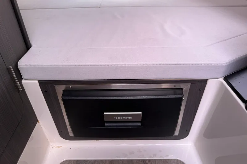 Slide: The Image of 2024 Navan C30 interior with Dometic appliance under cushioned seating. - 24