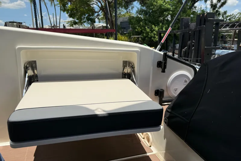 Slide: The Image of 2024 Navan C30 boat interior with foldable seat and storage compartment. - 42