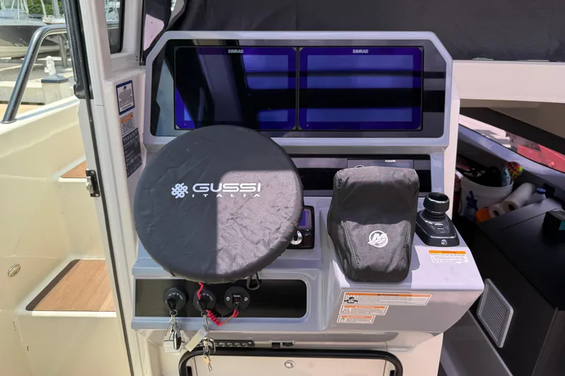 Slide: The Image of Control panel of 2024 Navan C30 boat with Gussi Italia steering wheel cover. - 10