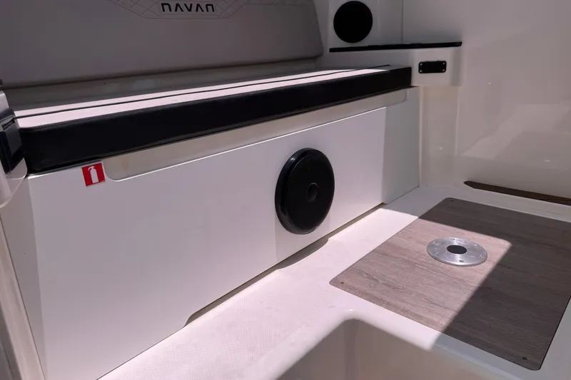 Slide: The Image of Interior of 2024 Navan C30 boat featuring seating and speaker system. - 15