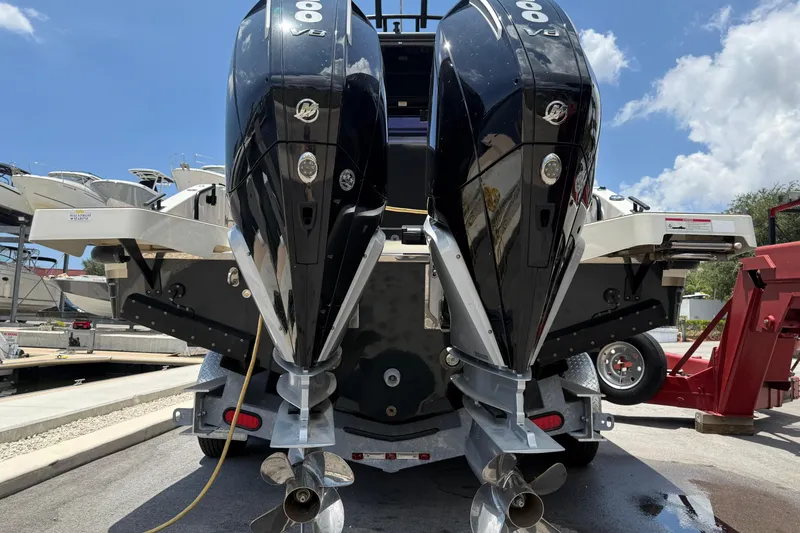 Slide: The Image of 2024 Navan C30 boat with dual powerful outboard engines at a marina. - 5