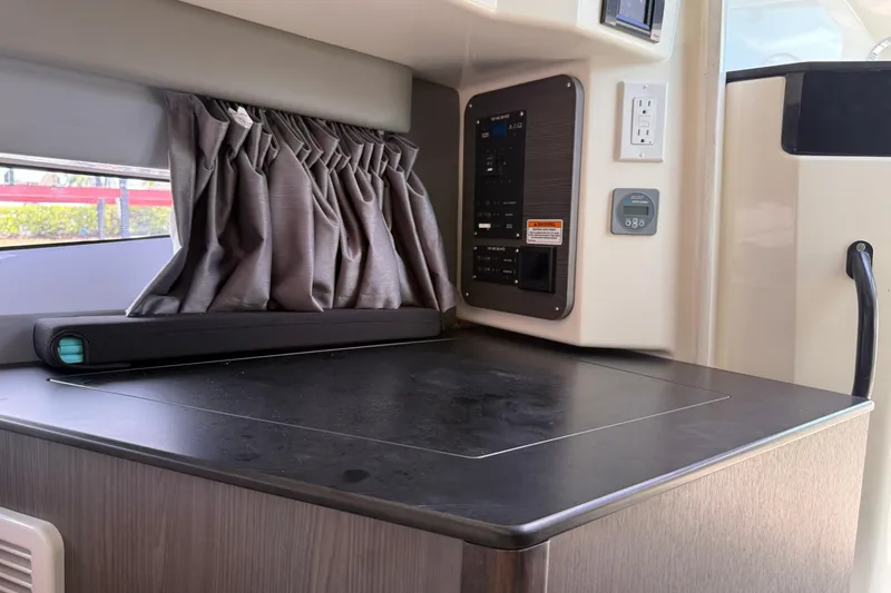 Slide: The Image of 2024 Navan C30 interior with control panel, countertop, and window curtains. - 22