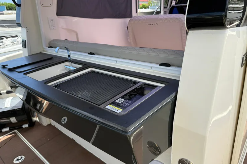 Slide: The Image of 2024 Navan C30 interior kitchen with sink and grill setup. - 41