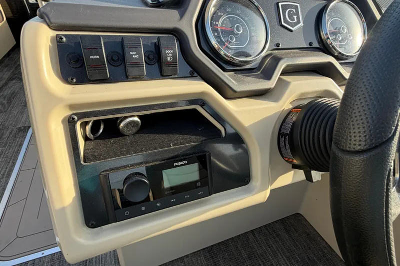 Slide: The Image of Dashboard of 2023 Godfrey Sweetwater 2286 C boat with controls and gauges. - 15