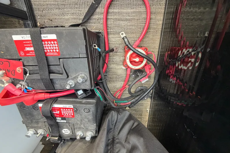 Slide: The Image of Battery setup in a 2023 Godfrey Sweetwater 2286 C boat, featuring wiring and connections. - 9