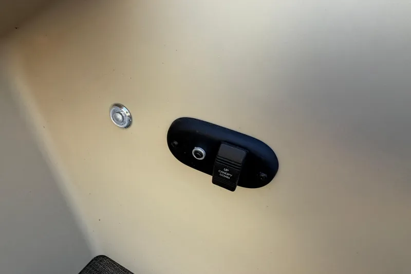 Slide: The Image of 2023 Godfrey Sweetwater 2286 C boat interior switch and button detail. - 17