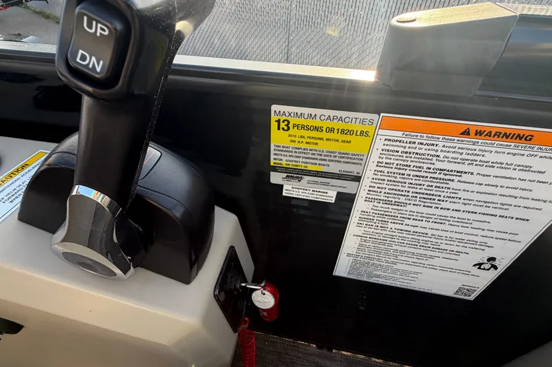 Slide: The Image of Control panel of 2023 Godfrey Sweetwater 2286 C boat with capacity and warning labels. - 13