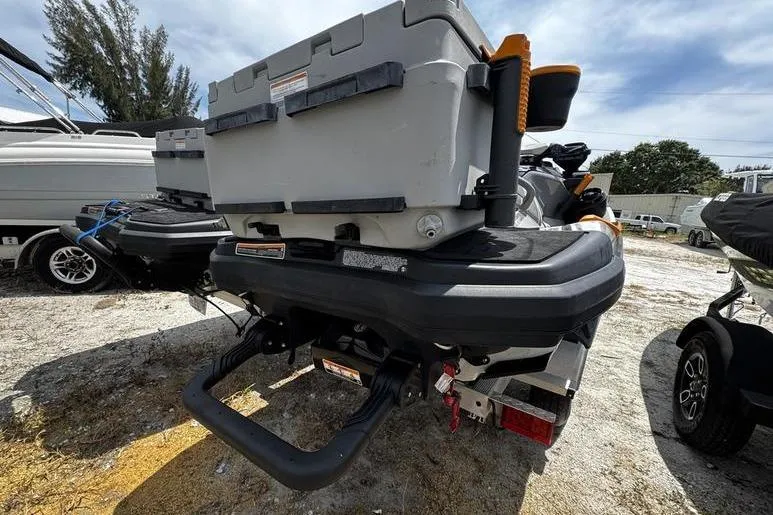 Slide: The Image of 2023 Sea-Doo FishPro Trophy with storage box, parked outdoors on a sunny day. - 7