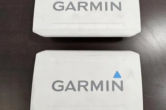 Slide: The Image of Two Garmin devices on a dark surface, related to Sea-Doo FishPro Trophy 2023. - 16