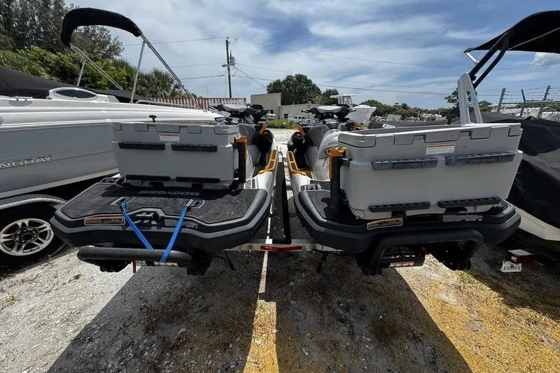 Slide: The Image of 2023 Sea-Doo FishPro Trophy jet skis parked on a trailer, rear view. - 6