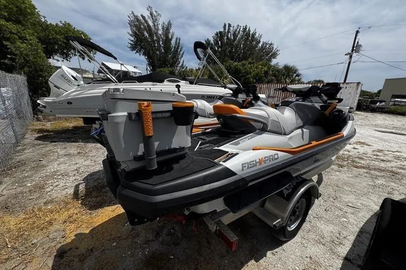 Slide: The Image of 2023 Sea-Doo FishPro Trophy jet ski parked outdoors on a trailer. - 8