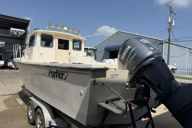 Slide: The Image of 2006 Parker 2520 SL Sport Cabin boat with Yamaha outboard motor on trailer. - 2