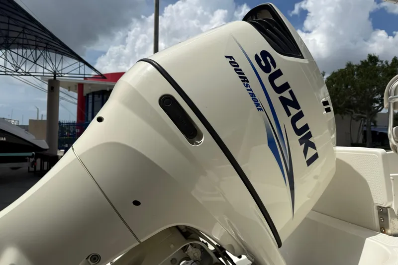 Slide: The Image of Suzuki four-stroke outboard motor on a 2015 NauticStar 231 Coastal boat. - 17