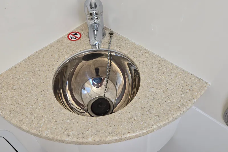 Slide: The Image of Stainless steel sink with faucet on Regulator 28 Forward Seating boat, 2018 model. - 21