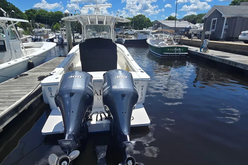 Slide: The Image of 2018 Regulator 28 Forward Seating boat docked with twin Yamaha 300 engines. - 5