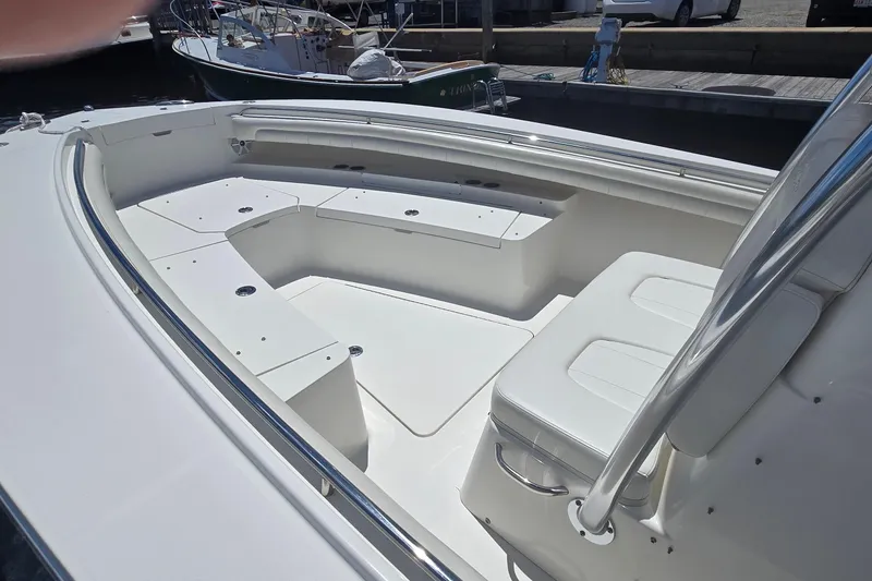Slide: The Image of 2018 Regulator 28 Forward Seating boat with spacious white seating area. - 8