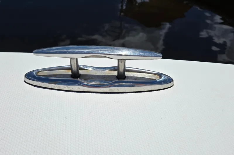 Slide: The Image of Chrome cleat on 2018 Regulator 28 Forward Seating boat deck, reflecting sunlight. - 14
