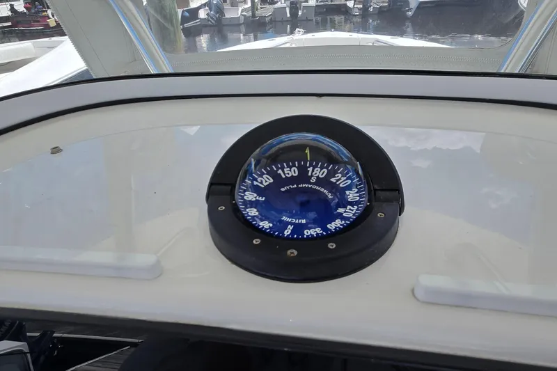 Slide: The Image of Compass on 2018 Regulator 28 Forward Seating boat dashboard, showing navigation details. - 25