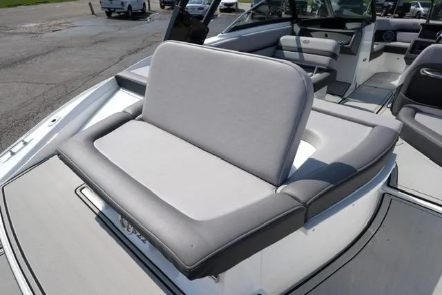 Slide: The Image of 2024 Cobalt CS22 boat with comfortable gray seating and sleek interior design. - 18