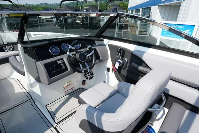 Slide: The Image of 2024 Cobalt CS22 boat interior with modern dashboard and steering wheel. - 13