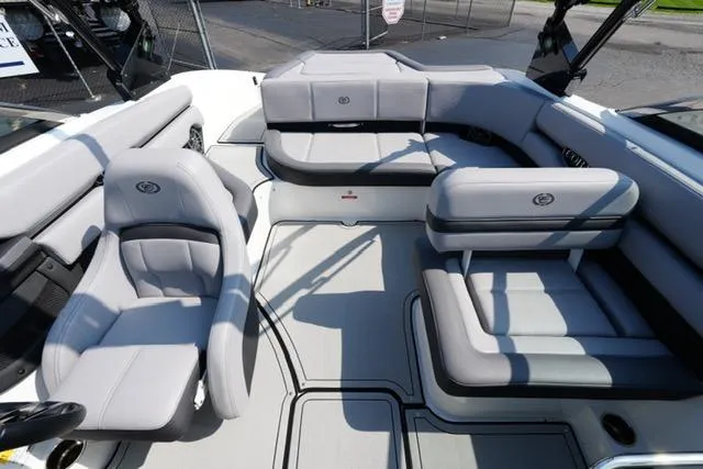 Slide: The Image of 2024 Cobalt CS22 boat interior with gray seating and modern design. - 15