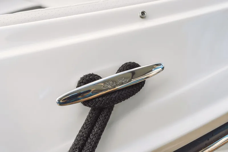 Slide: The Image of Close-up of a 2026 Sea Ray SDX 250 Outboard with a black rope on a cleat. - 49