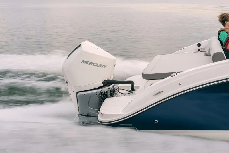 Slide: The Image of A 2026 Sea Ray SDX 250 Outboard speeds across the water, featuring a Mercury outboard engine. - 40