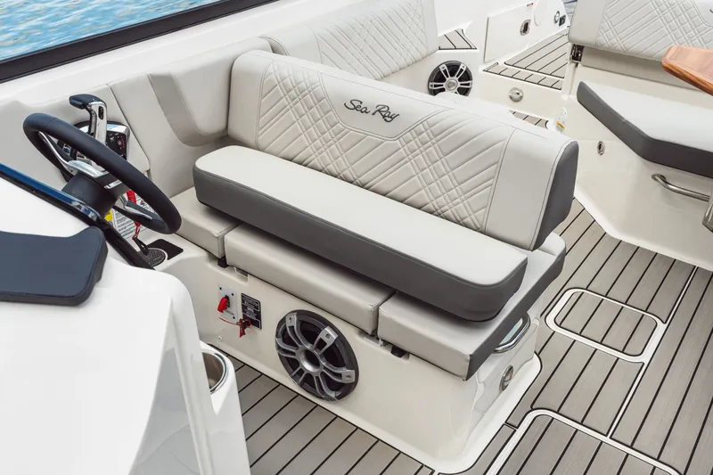Slide: The Image of The image shows the cockpit of a 2026 Sea Ray SDX 250 Outboard with sleek seating and modern controls. - 23
