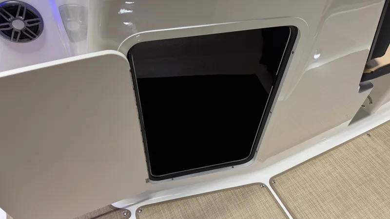 Slide: The Image of An open door on a boat reveals a dark storage compartment. Beige flooring is visible. - 47