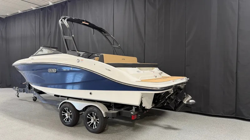 Slide: The Image of A 2027 Sea Ray SPX 210 boat on a trailer in a showroom setting. - 3