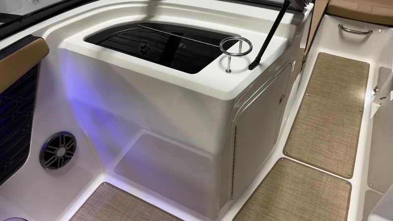 Slide: The Image of Interior view of a Sea Ray SPX 210 with sleek seating and blue lighting. - 44