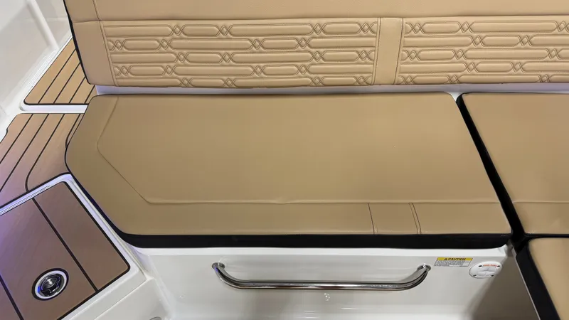 Slide: The Image of Close-up of a cushioned bench seat on a 2027 Sea Ray SPX 210 boat. - 27