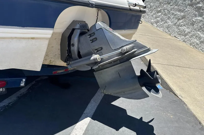 Slide: The Image of 2002 Chaparral 205 SSe boat with Volvo Penta outdrive, parked on pavement. - 8