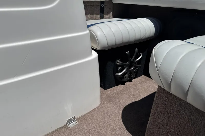 Slide: The Image of Interior of a 2002 Chaparral 205 SSe boat with white seating and speaker. - 18