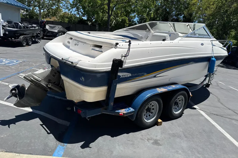 Slide: The Image of 2002 Chaparral 205 SSe boat on trailer in parking lot, rear view. - 6
